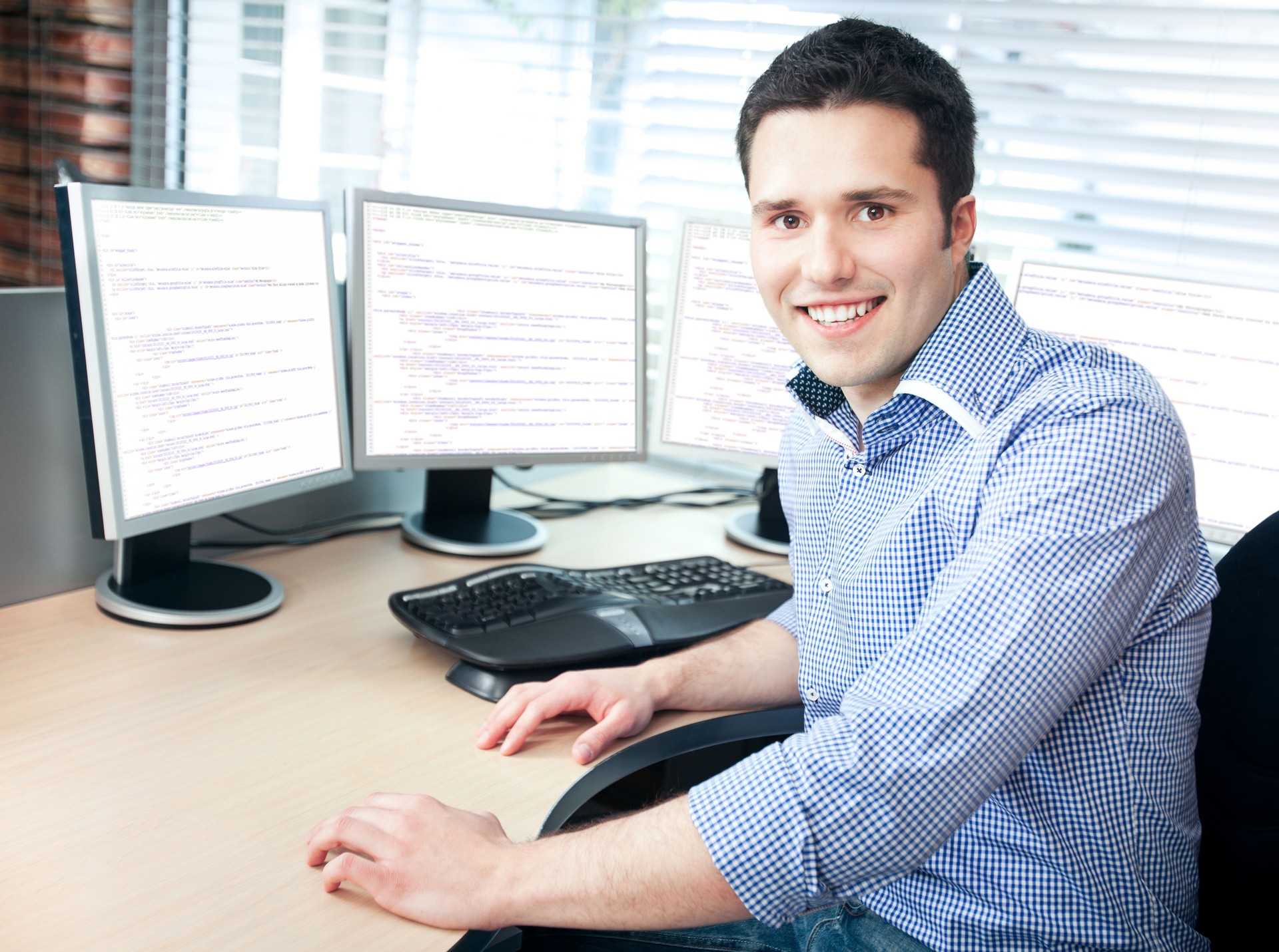 Smiling Young  Businessman at Office
